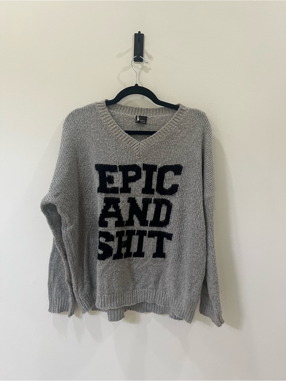 Sparkle & Fade Gray V-Neck Sweater with Black Bold Text